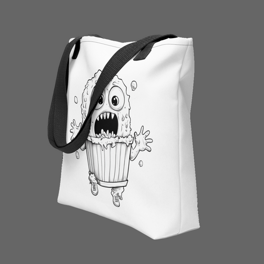 Tote bag with a black and white illustration of a monster cupcake on a white background