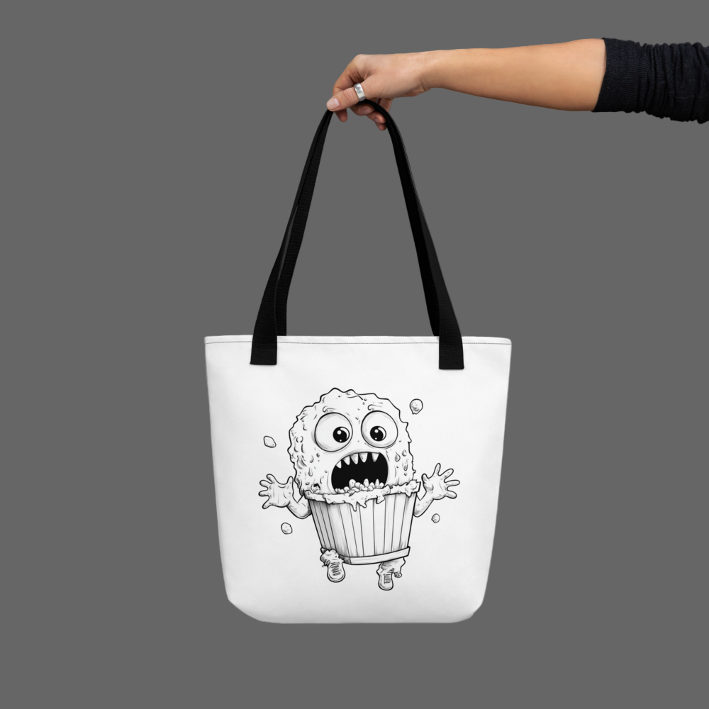 Tote bag with a black and white illustration of a creature in a trash can, held by a hand against a gray background.