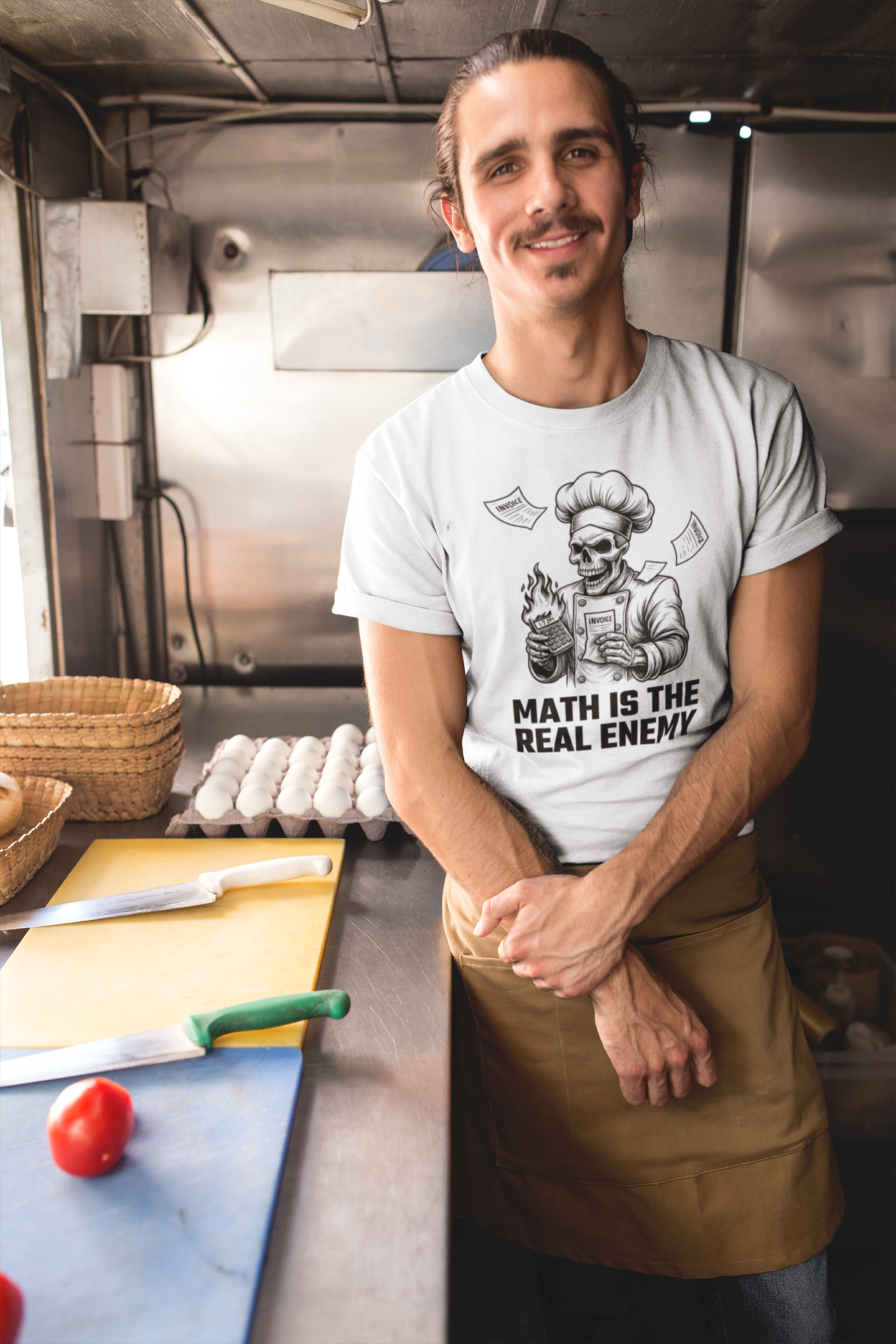 Person wearing a t-shirt with a graphic design in a kitchen setting