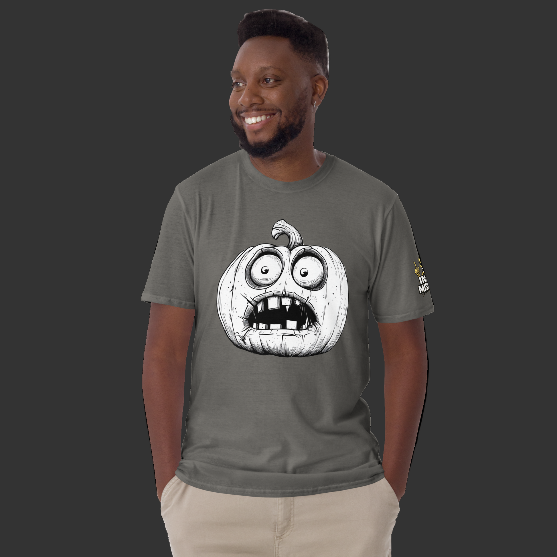 Man wearing a gray t-shirt with a pumpkin graphic design on a white background