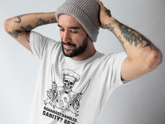 Man wearing a white t-shirt with a graphic design and text, posing against a plain background.