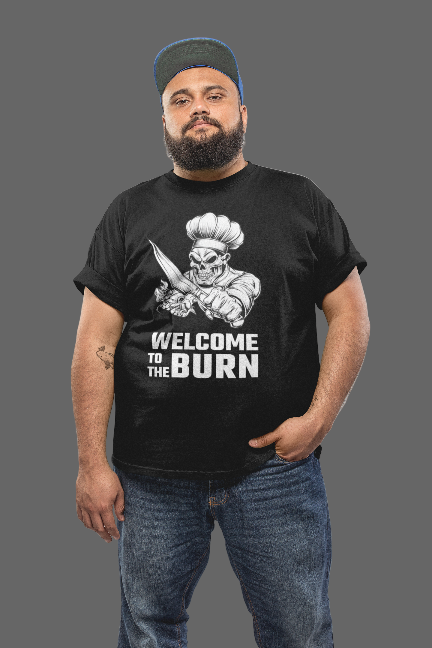 Man wearing a black t-shirt with graphic design and text, standing against a plain background